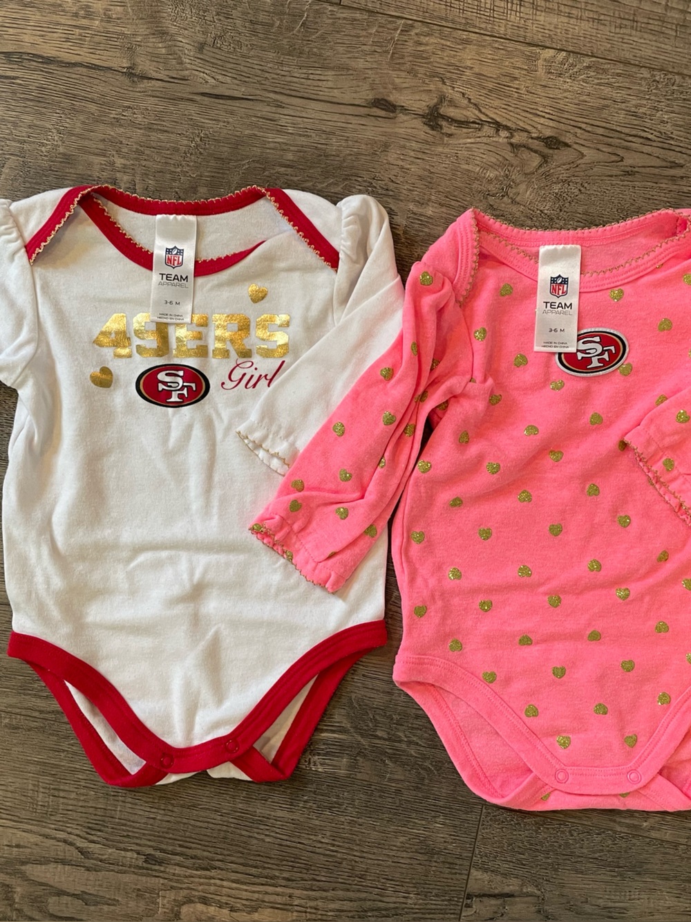 NFL San Francisco 49ers Girls White & Pink Heart One-Piece Bodysuits